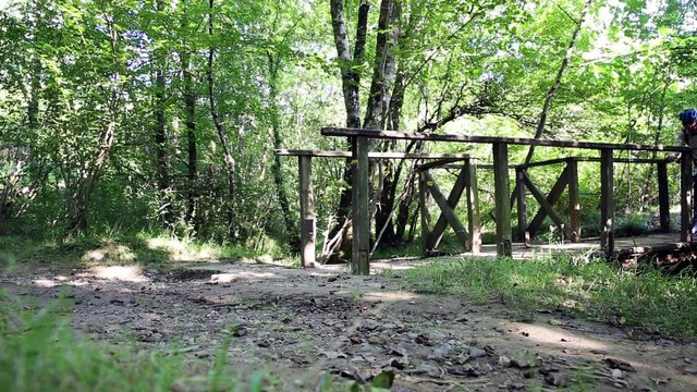Bicycle touring in the woods and a wooden bridge