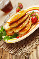 Homemade pancake with honey and strawberry