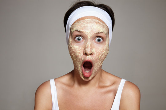 woman have fun making facial treatment