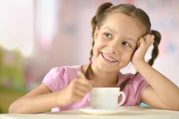 Cute little girl with cup