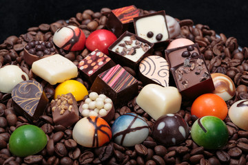 Set of a various chocolate pralines and coffee beans