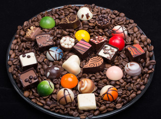 Set of a various chocolate pralines and coffee beans