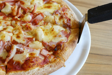 delicious hawaiian rustic style pizza made with fresh pineapples