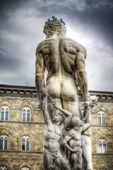 Fototapeta na wymiar back view of Neptune statue in Piazza della Signoria in Florence