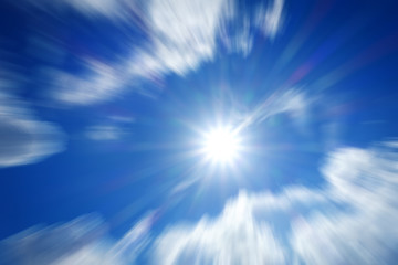 Naklejka na ściany i meble Blurred image of the sun on sky in summer day.