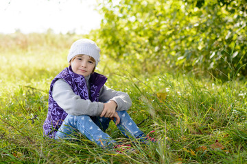 Child sitting on the grass