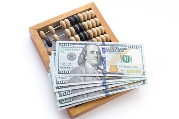 abacus with dollars