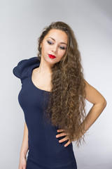 Naklejka premium beautiful girl in a blue dress