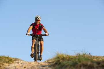 on the mountainway with bike - mountainbiker to go down