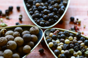 Black, green, red and white pepper