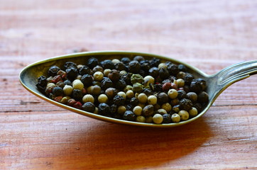 Black, green, red and white pepper