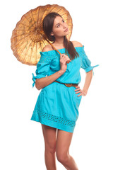Pretty girl in blue dress with umbrella isolate on white background
