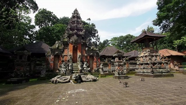 Monkeys at Pura Dalem Agung Padangtegal Temple (Great Temple of Death) in the Monkey Forest Sanctuary in Ubud, Bali, Indonesia.