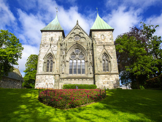 Fototapeta na wymiar STAVANGER, NORWAY - JULY 09, 2015: East facade of Stavanger Cathedral (Stavanger domkirke, circa XIII c.). The oldest cathedral in Norway, city landmark of Stavanger