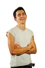 A smile young man with arms crossed looking at the camera isolated on white