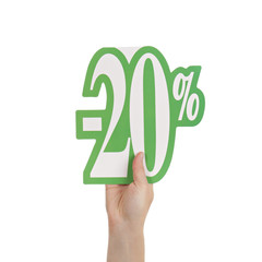 femme tenant écriteau soldes 20 pour-cents