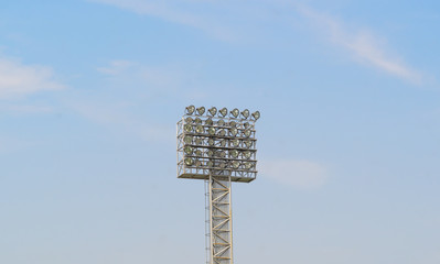 Big spotlights lighting tower at an sport arena stadium