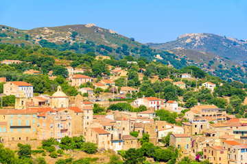 Fototapeta na wymiar View of Cateri village with stone houses built in traditional Corsican style on top of a hill, Corsica island, France