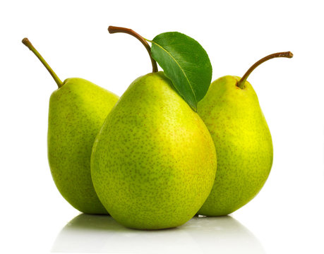 Three green pear fruits with leaves isolated