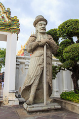 Obraz premium European giant statue at Wat Pho temple, Bangkok, Thailand