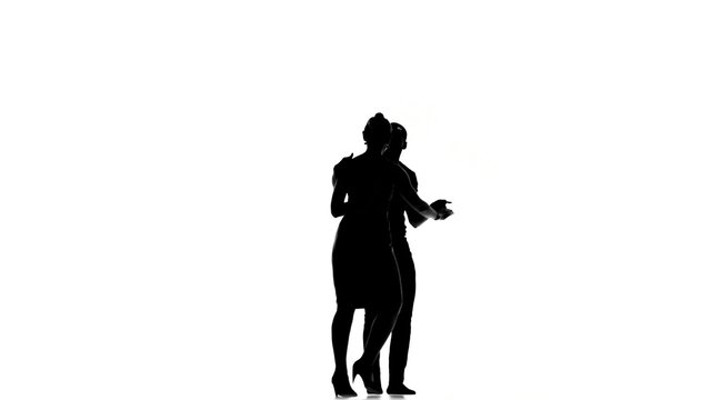Latino dancers in action on white, silhouette