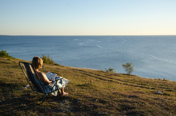 Reading book at seaside