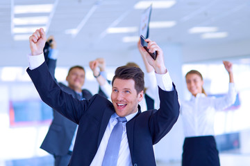 Business team celebrating a triumph with arms up 