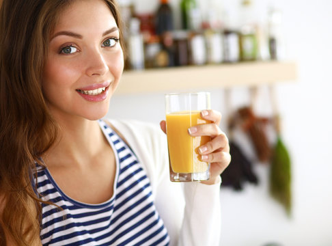 Portrait Of A Pretty Woman Holding Glass With Tasty Juice