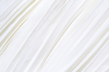 Background of white pleated fabric