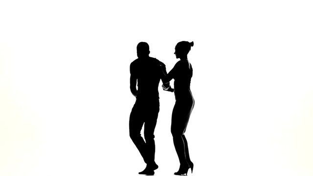 Couple of social latino dancers starts dancing on white, slow
