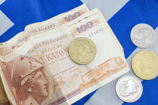 Greek Old Currency Drachma Banknotes On The Greek Flag