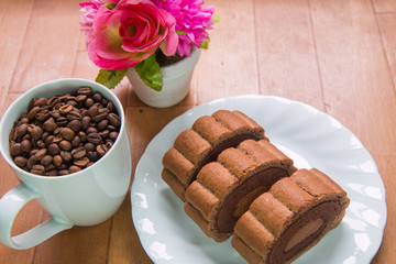 Coffee beans and Chocolate roll cake