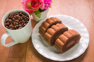 Coffee beans and Chocolate roll cake