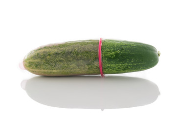 cucumber with condom isolated on white background
