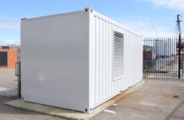 A large industrial metal container painted light grey