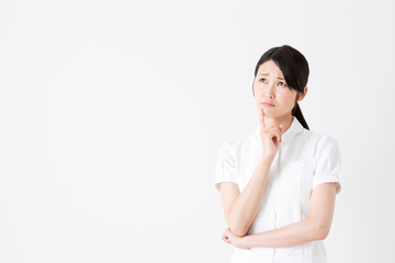 young asian nurse on white background