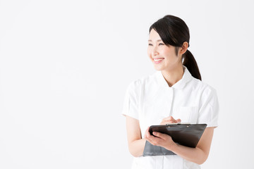 young asian nurse on white background