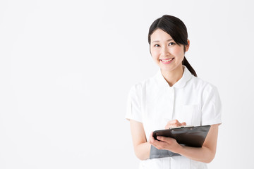 young asian nurse on white background