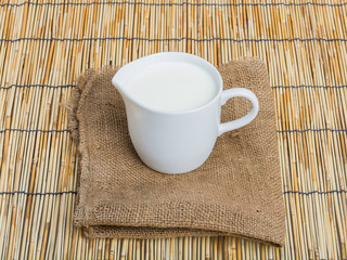 Cow milk and ceramic jug