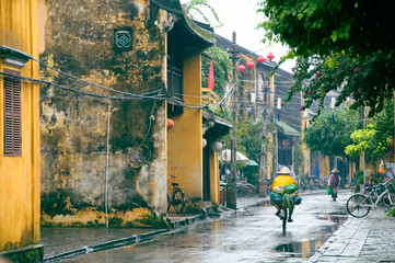 Normal life in a rainy day, Hoi An, Danang, Vietnam. Hoi An is an UNESCO World Heritage site, a major touristic destination in Central Vietnam.