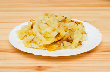 Fried potatoes on a white plate