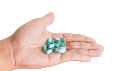 pill in male hand on white background isolated