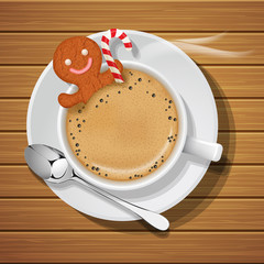 gingerbread in cup of hot coffeee with sugar cane