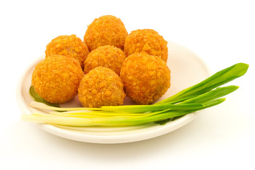 Crispy cheese balls with green onion on the plate