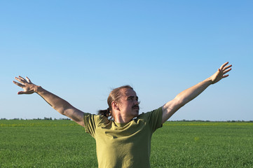 Young man spreading arms