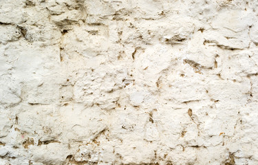 Background of old cracked painted stone wall with cement