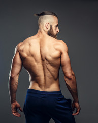 Fototapeta na wymiar Shirtless bodybuilder's back.