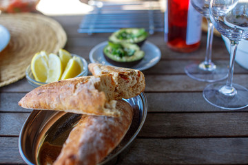Fresh brown bread on wooden table.