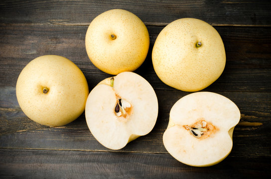 Asian pear on wooden background