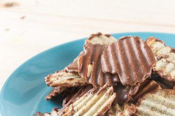 potato chip with chocolate on wood